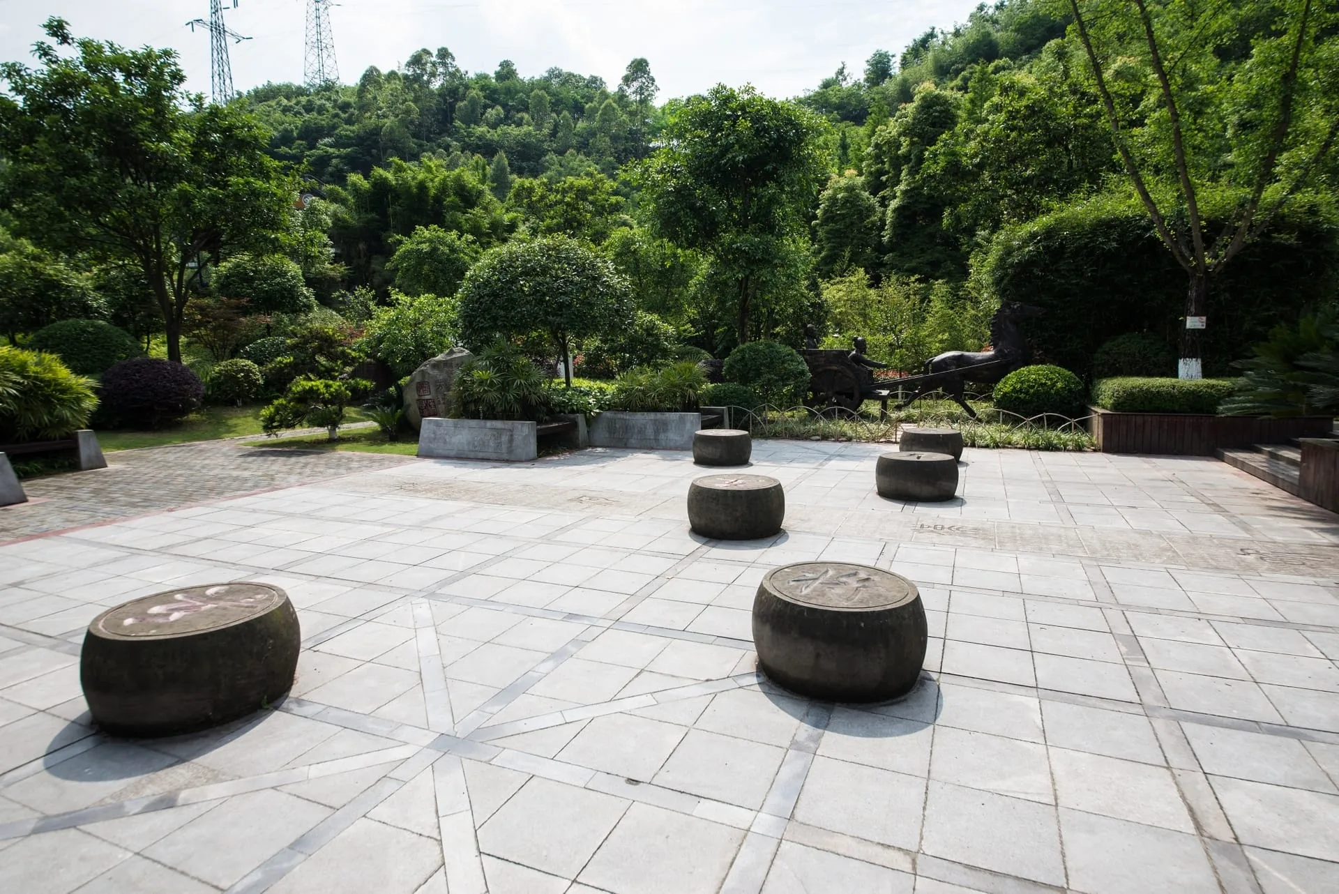 Natural stone planters and border pieces in a garden setting